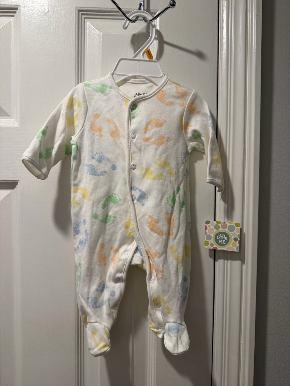 Little Me White Footed One-Piece with Pastel Footprint Pattern-size newborn